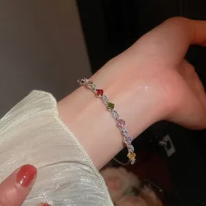 Elegant silver bracelet with colorful zircons and geometric star charms for women