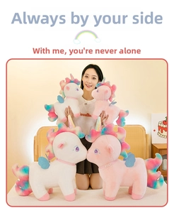 Lifestyle shot of white and pink stuffed unicorn plush toys with rainbow manes and wings