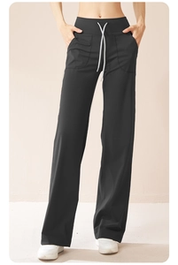 Detail of high waisted wide leg yoga pants with white drawstring and side pockets