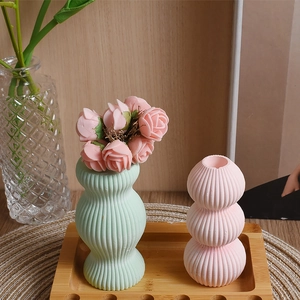 Vertical ribbed texture detail on Morandi-style wave and triple ball decorative vases