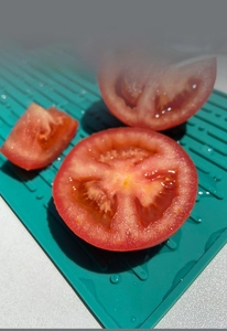 Macro detail of green silicone drying mat with ribbed anti-slip drainage surface