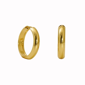 Macro detail of thick gold hoop earrings with mirror-finish and hinged closure