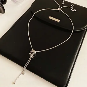 Minimalist silver zircon circle pendant necklace with heart charms on black leather