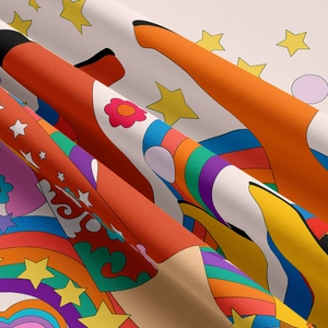 Close-up of retro pop art tapestry fabric featuring rainbow stars and floral patterns