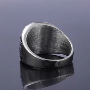 Macro shot of retro stainless steel ring band showing brushed metal and polished edges