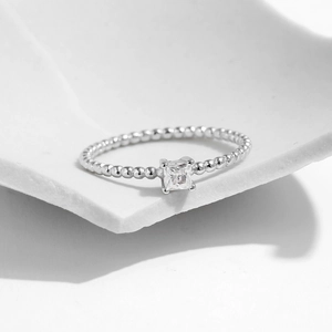 Minimalist s925 silver ring featuring a geometric square diamond on a beaded band