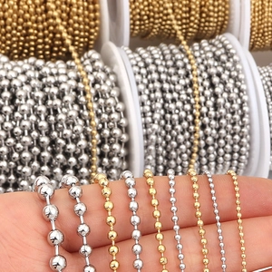 Various sizes of gold and silver stainless steel ball chains shown on fingers for size comparison
