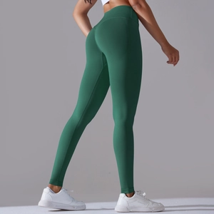 Detailed back view of high waisted forest green yoga leggings with butt lifting design