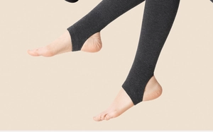 Detailed knit texture of warm dark grey stirrup leggings for women with vertical stripes