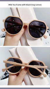 Close-up of trendy jelly polygon sunglasses in milk tea beige with black grey lenses