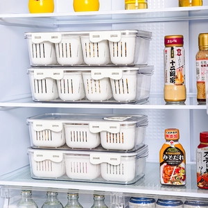 Stackable transparent plastic fridge storage boxes with white draining baskets for kitchen