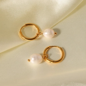French vintage titanium hoop earrings with freshwater pearls on gold silk background