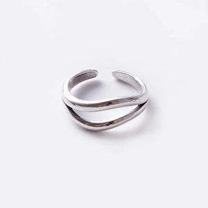 Detail of vintage silver double-layer open ring with matte metallic texture