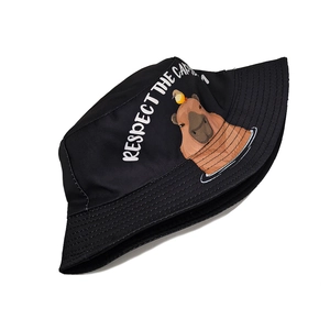 Close-up of the Capybara cartoon illustration and text on the black cotton bucket hat