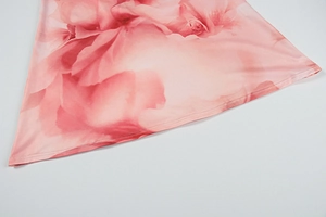 Detail of pink watercolor rose print dress hem with neat double-stitched finishing