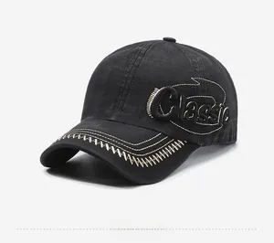Detail of classic black washed cotton baseball cap with white side embroidery and stitching