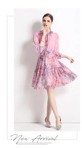 Pink floral chiffon dress detail with ruffled neckline and elegant long lantern sleeves
