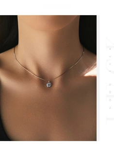 Macro shot of s925 silver necklace with sparkling round cubic zirconia pendant on neck