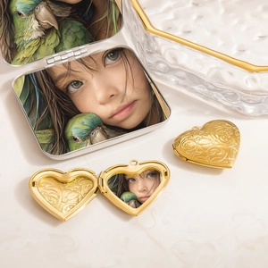 Vintage heart shaped locket necklace in polished gold with embossed floral patterns
