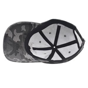 Detail of internal camo baseball cap construction with 100% cotton label and black stitching