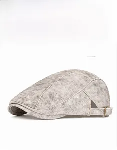 Detail of grey vintage washed texture and metal adjustable buckle on newsboy flat cap