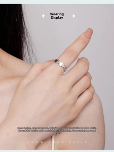 Detail of s925 silver puzzle piece open ring worn on finger with high polish finish