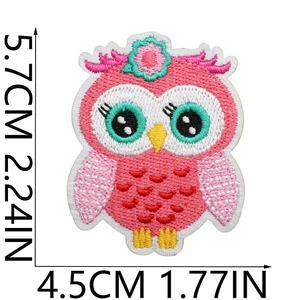 Detail of pink owl embroidered patch with dimensions 5.7x4.5cm for spring apparel