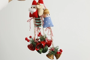 Handmade crochet Christmas charms featuring Santa, reindeer, and bells on a rope