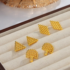 Three-pair set of geometric gold plated steel stud earrings with beaded tree and diamond shapes