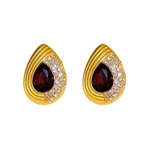 Elegant gold teardrop earrings with deep red stones and sparkling diamond pavé accents