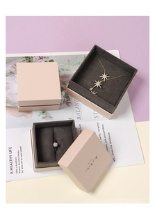 Elegant beige jewelry gift boxes with plush grey lining and Best Wishes gold lettering