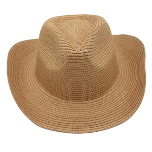 Detailed close-up of brown woven straw cowboy hat with classic fedora crown and wide brim
