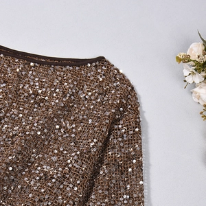 Detail of high-density bronze and gold sequins on breathable mesh fabric top