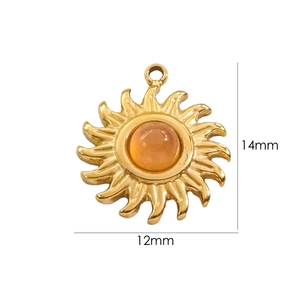 Detailed view of sun-shaped gold pendant with orange gemstone showing dimensions 14mm by 12mm