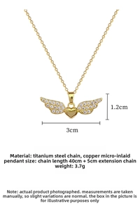 Detail view of heart and wing pendant showing 3cm width and zircon micro-inlay finish
