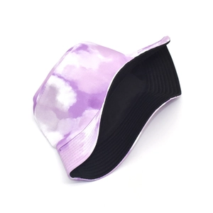 Detail view of tie-dye bucket hat with purple cloud pattern and black inner lining