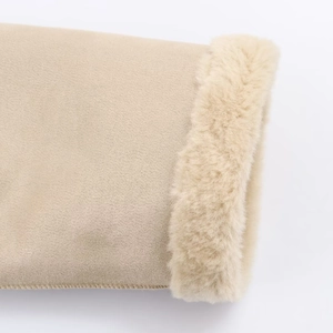 Detail of beige jacket cuff featuring premium faux suede and thick soft faux fur trim