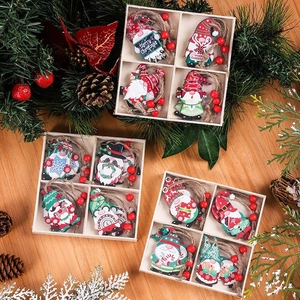 Set of 12 festive wooden Christmas gnome ornaments in a storage box for tree decoration