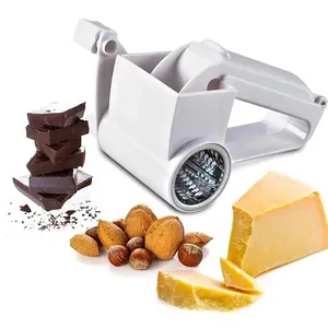 Rotary cheese grater with stainless steel drum and assorted nuts on a clean white background