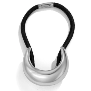 Close-up of a silver crescent-shaped metal hair tie with a black elastic band