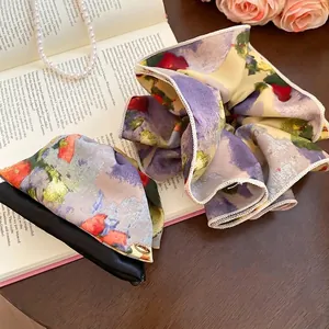 Oil painting style floral silk scrunchie with vintage art print on classic book background