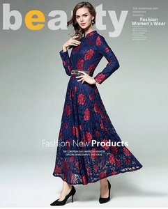 Detail view of navy blue floral lace maxi dress with long sleeves and black belt