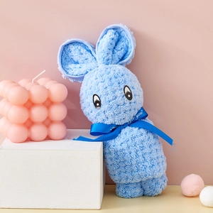 Detail of blue rabbit-shaped coral fleece towel with Just For You ribbon and soft texture