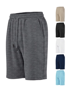 Detail view of waffle texture fabric on men's casual shorts with drawstring waist