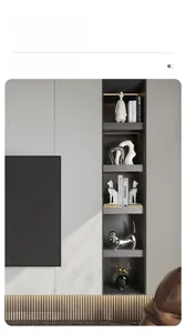 Modern minimalist white ceramic sculptures and silver dachshund figurine on a grey shelf