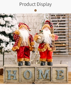 Charming red and brown Santa figurines with backpacks on rustic wooden blocks