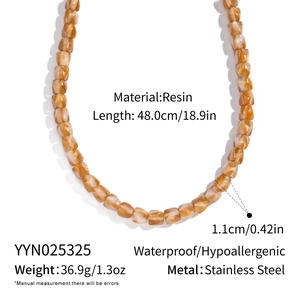 Close-up of brown resin beaded necklace with square faceted beads and stainless steel clasp