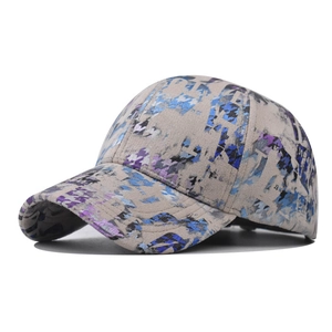 Detailed close-up of vibrant tie-dye pattern on structured canvas baseball cap fabric