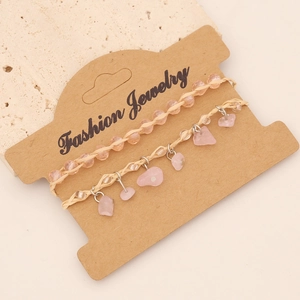 Bohemian two-piece bracelet set with pink natural stone and woven rope on paper card