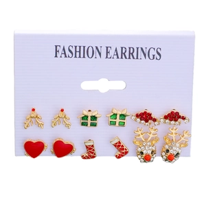 Detail of 6-pair Christmas stud earring set featuring reindeer, festive hat, and gift box designs